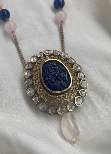 Carved stone pendants
